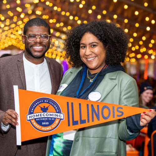 Posing for photo with Illinois pennant